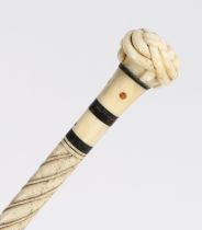 A 19th century whalebone tortoiseshell and inalid walking stick, the handle carved as a trinity knot