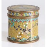 A Chinese Cloisonne enamel cylindrical pot and cover, having a yellow ground set with floral blossom