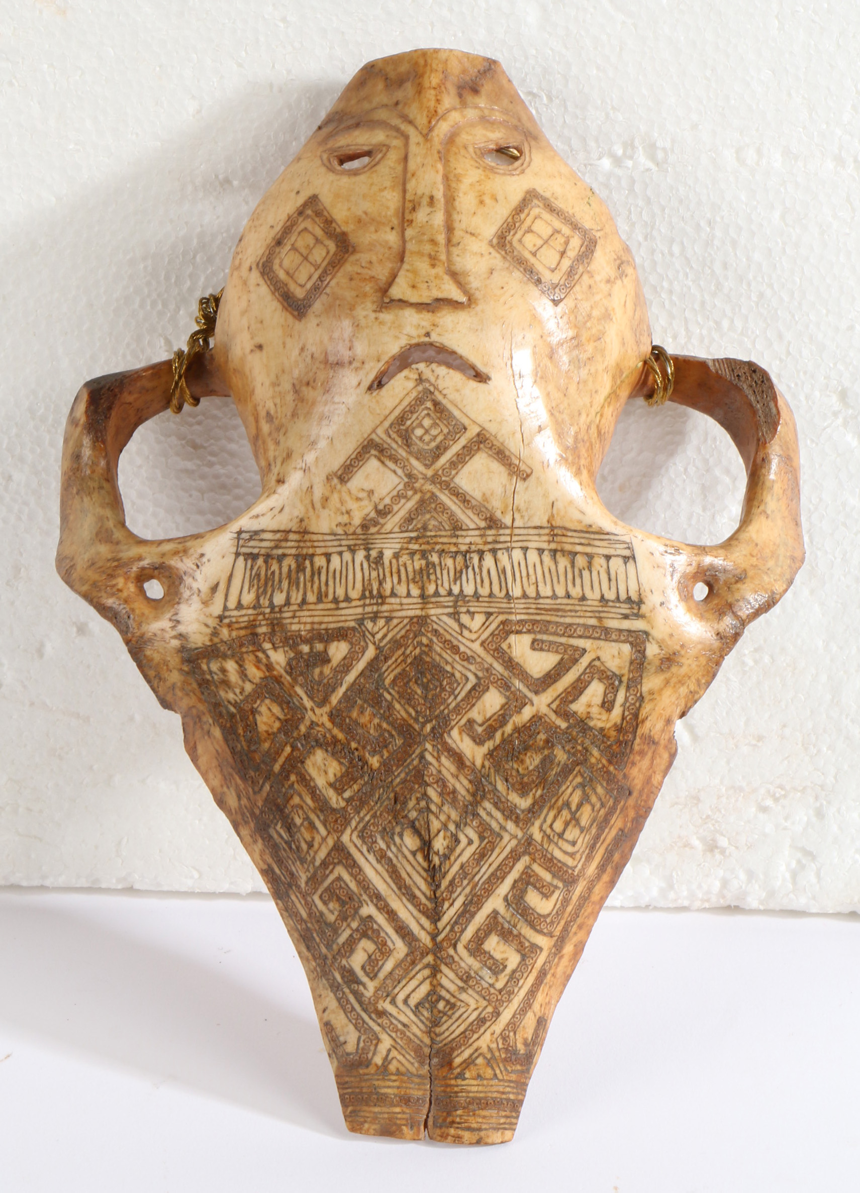 A Late 19th/early 20th century Indonesian Belu-Atoni Timor cow skull mask, having a carved mouth and