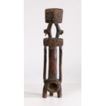 A East African Carved Figure of Ngombe from the Democratic Republic of Congo, having a geometric