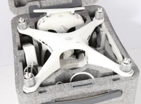 DJI Phantom 4 Drone with fitted carrying case, controller, charger, manual, etc. (damaged,