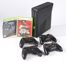 Microsoft Xbox 360 S (Model 1439) in black, together with four controllers (all lacking battery