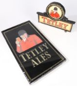 A glazed advertising sign featuring the Tetley Huntsman above "TETLEY ALES", 52cm x 29cm. Together