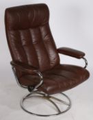 A mid to late 20th Century Scandinavian faux leather and chromed adjustable armchair on swivel base,