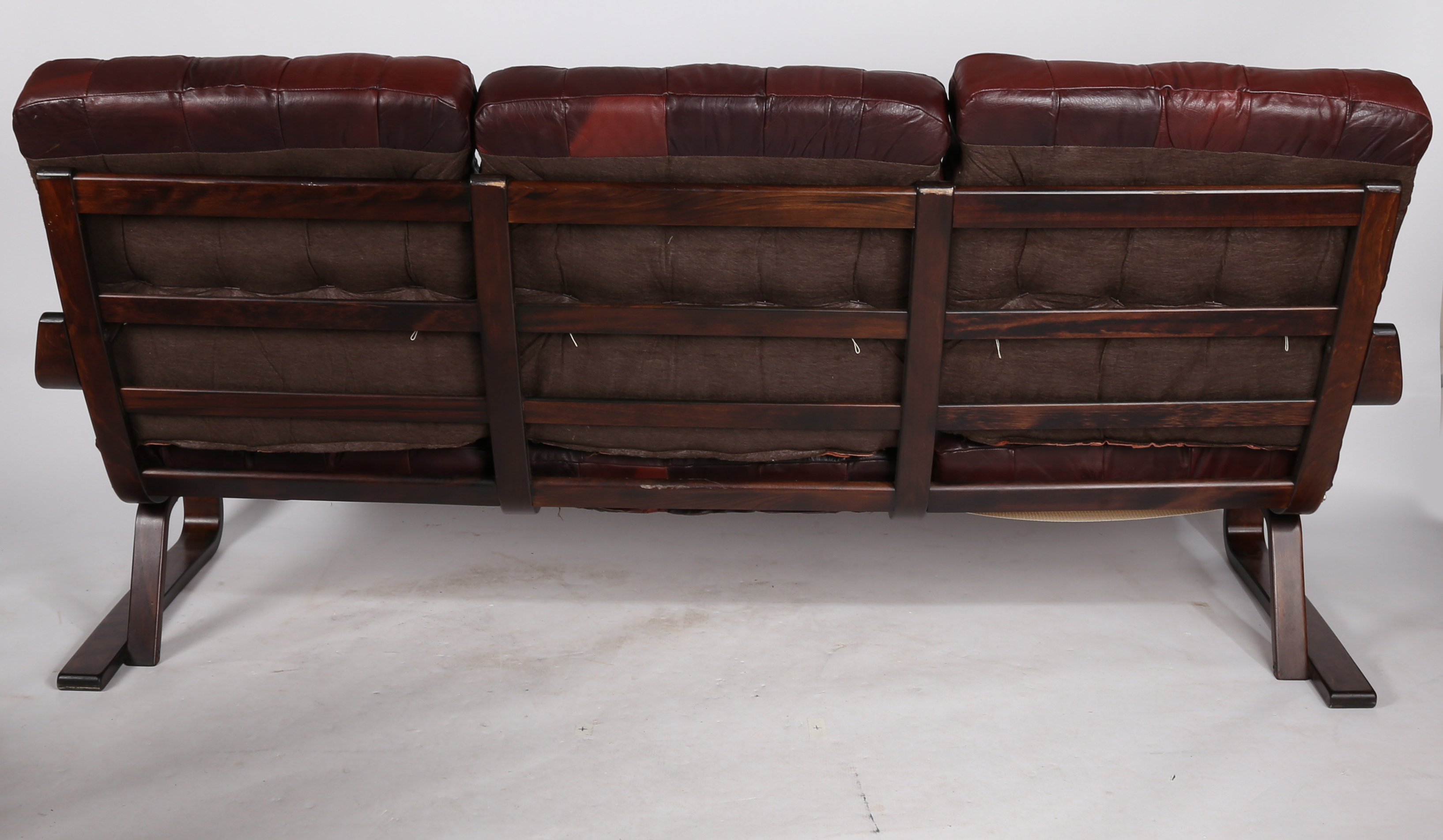 A mid 20th Century Scandinavian leather and bent wood three piece suite, comprising of a three - Image 7 of 10