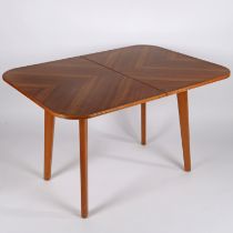 A mid century teak dining table