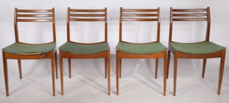 A set of four circa mid 20th Century upholstered dining chairs by Bentalls, with makers labels. 77cm