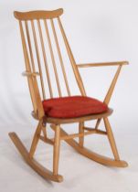 A mid 20th Century Ercol blonde rocking chair, with maker label. 85cm x 62cm x 65cm.