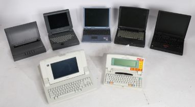A collection of retro laptops to include Brother, Canon, Compaq, IMB ThinkPad, and U Lite.