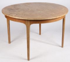 Nathan Furniture. A teak circular topped extending dining table, 122cm diameter, 76cm height.