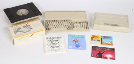 Commodore Amiga 500 in original packaging, together with a Commodore MPS1270 printer, a RocLite