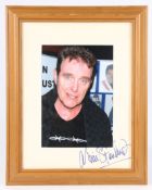 Alvin Stardust. A framed and glazed picture, autographed to the mount in blue ink. 50cm x 39cm.