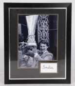 Bobby Robson, mounted signature with photograph, depicting him holding the UEFA cup after the 1981