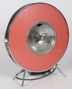 A circa 1960s Sofono 'flying saucer' electric convection heater in red colourway. Designed by