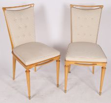 A pair of beech and upholstered dining chairs. 86cm tall, 42cm wide, 45cm deep. (2)