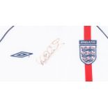 England National Football Team 2002 Home shirt autographed by Michael Owen. Famed and glazed, 90cm x