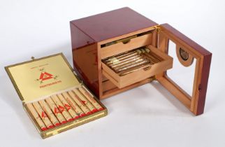 A cigar humidor, with front hygrometer. Contents include (9x Hamlet Special Panatellas, 3x King