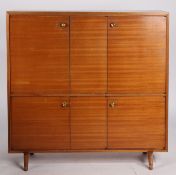 A circa mid 20th Century nutwood finished cabinet by Bentalls, with makers plaque and retailers