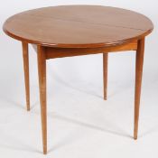 A mid century teak extending dining table by Bentalls (lacking leaf), with makers label. 92cm