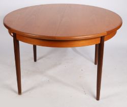 A mid 20th Century teak extending dining table by G Plan, 122cm diameter, 72cm height.