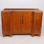 Art Deco oak breakfront sideboard by G-Plan (E. Gomme), the top with gallery above four cupboard