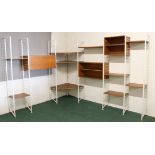 A mid 20th Century teak Ladderax corner modular system on white steel supports, to include various