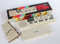 Casio VL-1 VL-TONE electronic musical instrument & calculator with original box and packaging.
