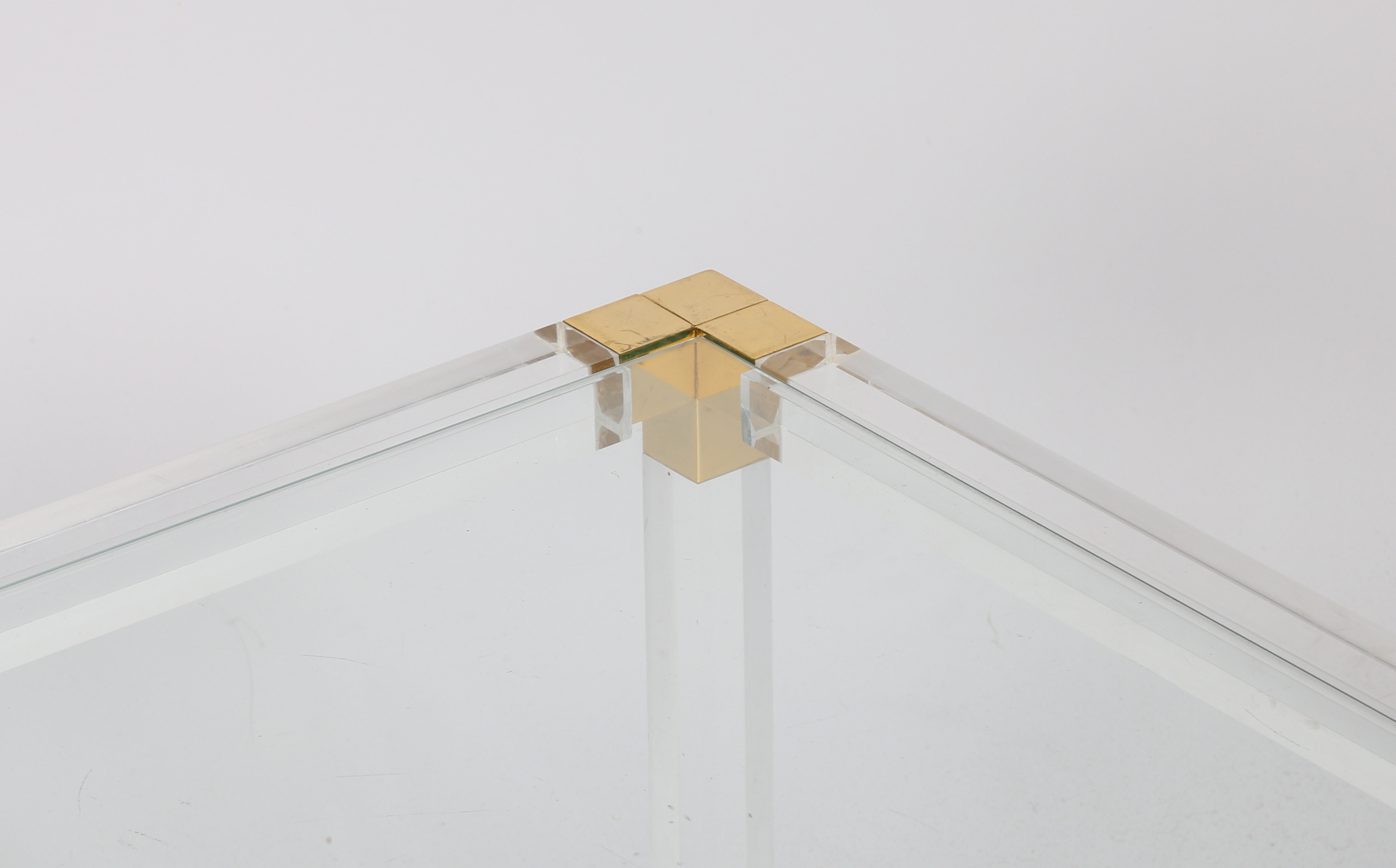 A rectangular coffee table, circa 1970s, the glass top supported on Lucite and gilded metal finished - Image 4 of 4