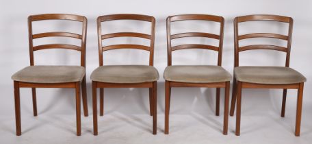 A set of four 80s teak and upholstered dining chairs by G Plan, with makers labels. 80cm x 44cm x