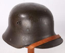 First World War German M16 Steel Helmet, marked to the inside rim 'BF 64' for the maker F.C.