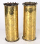 First World War trench art, vases in the form of two German 77mm shell cases, the rims cut into