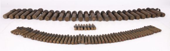 Belt of 20 mm Cannon shell cases, metal linked, seem to be a mix of British and U.S. makes,