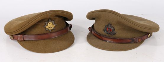 Two Post War British Officers Service Dress Caps, one with bronzed Queens crown Suffolk Regiment cap