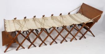 First World War period Officers 'Cabinetta' folding campaign bed by W & S, Wales, wood and canvas