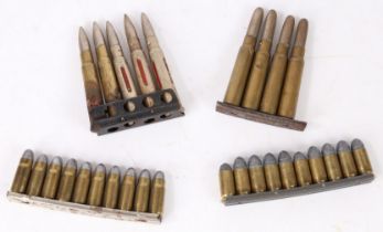 Charger clip of 4 Mannlicher 6.5 rounds, together with a clip of 5 .303 training rounds (brass and