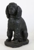 A reconstituted stone figure of a seated spaniel, 49cm high