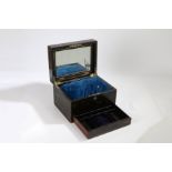 A Victorian coromandel vanity box, the hinged lid enclosing an interior with a mirror, a