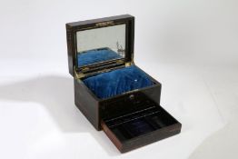 A Victorian coromandel vanity box, the hinged lid enclosing an interior with a mirror, a
