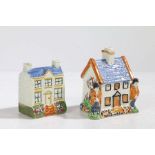 Two 19th century Pratt Ware polychrome money boxes/banks, each in the form of houses, one with two