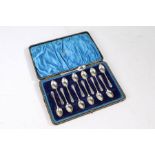 Thirteen George V silver teaspoons, Sheffield 1933, maker Walker & Hall, with crossed golf club