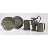 A collection of pewter to include a quart and a pint mug, a ewer and two dishes (5) TRANSFER