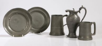 A collection of pewter to include a quart and a pint mug, a ewer and two dishes (5) TRANSFER