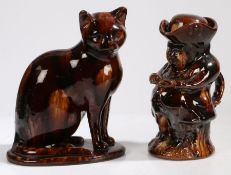 A 19th century treacle glazed cat, and a similar Ralph Wood style toby jug, 27cm tall & 25cm tall (