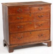 A George III mahogany chest of two short and three long drawers, with brass swan neck handles,