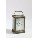 An Early 20th Century brass carriage clock, the white enamel dial with Roman numerals, 14.5cm high