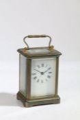 An Early 20th Century brass carriage clock, the white enamel dial with Roman numerals, 14.5cm high
