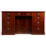 A Victorian mahogany desk, the tooled green leather inset top above three frieze drawers, three