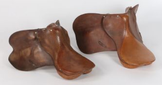 Two brown leather horse saddles (2)