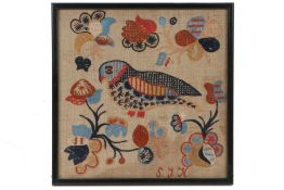 A polychrome needlework embroidery of a bird, initialled S.J.K., surrounded by flowers, housed in an