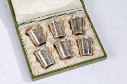 A set of six French silver tot cups, makers mark AD, the cups with crests of Lens, Amiens, Albert,